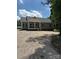 Charming single story home featuring a covered porch, gravel driveway and well-manicured lawn at 7426 Hambright Rd, Huntersville, NC 28078