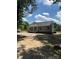 Well-maintained single-story home with siding, a covered porch, and a spacious front yard under a blue sky at 7426 Hambright Rd, Huntersville, NC 28078