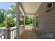 Charming front porch with wood flooring, perfect for enjoying the outdoors at 7426 Hambright Rd, Huntersville, NC 28078