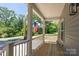 Inviting front porch with wood flooring, ideal for relaxing outdoors at 7426 Hambright Rd, Huntersville, NC 28078