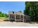 Charming one-story home boasts a well-manicured front yard and inviting front porch at 7426 Hambright Rd, Huntersville, NC 28078