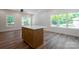 Kitchen island boasts stylish wood cabinets and a bright quartz countertop at 7426 Hambright Rd, Huntersville, NC 28078