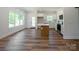 Sunlit kitchen and breakfast area with stainless steel appliances and center island at 7426 Hambright Rd, Huntersville, NC 28078
