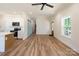 Bright living area featuring wood floors, modern lighting, and a barn door at 7426 Hambright Rd, Huntersville, NC 28078