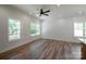 Spacious living room with wood-look flooring, wainscoting, recessed lighting, and bright, natural light at 7426 Hambright Rd, Huntersville, NC 28078