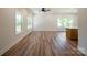 Open-concept living room featuring hardwood floors, recessed lighting and windows with backyard views at 7426 Hambright Rd, Huntersville, NC 28078