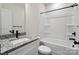 Clean, modern bathroom with granite countertop, a framed mirror, and tub and shower combo at 746 Shasta Nw St, Concord, NC 28027