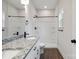 Bathroom featuring a double vanity with granite countertop and shower with shelves at 746 Shasta Nw St, Concord, NC 28027