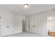 Bright bedroom featuring neutral carpet, white walls, double closets, and entry to bath at 746 Shasta Nw St, Concord, NC 28027