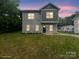 Front exterior of home showing siding, green front door, and trimmed lawn at 746 Shasta Nw St, Concord, NC 28027