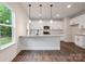 Modern kitchen features granite countertops, stainless steel appliances, and stylish pendant lighting at 746 Shasta Nw St, Concord, NC 28027