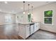 Bright, open-concept kitchen with a stylish island and granite countertops, perfect for entertaining at 746 Shasta Nw St, Concord, NC 28027