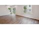 Spacious living room featuring wood-look floors, lots of windows, and plenty of natural light at 746 Shasta Nw St, Concord, NC 28027