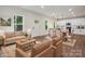 This living room is staged with comfortable seating and connects the kitchen and dining area at 746 Shasta Nw St, Concord, NC 28027