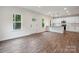 Bright and airy living room featuring wood flooring, white walls, and recessed lighting at 746 Shasta Nw St, Concord, NC 28027
