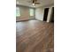 A spacious bedroom with two windows and wood-look flooring offers lots of natural light at 8222 Madison Ln, Hickory, NC 28602