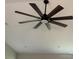 A modern ceiling fan with dark wooden blades is installed in the ceiling of the home at 8222 Madison Ln, Hickory, NC 28602