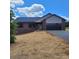 New brick home with a modern two-car garage, paved driveway, and freshly strawed yard under a sunny sky at 8222 Madison Ln, Hickory, NC 28602