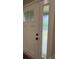 A new white front door with windows offers both security and style to the home's entry at 8222 Madison Ln, Hickory, NC 28602
