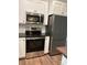 A modern kitchen featuring new GE stainless steel appliances at 8222 Madison Ln, Hickory, NC 28602