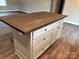 A kitchen island with drawers, cabinets, and a wood countertop offers ample workspace and storage at 8222 Madison Ln, Hickory, NC 28602