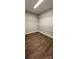 Walk-in closet with dark wood flooring and multiple levels of wire shelving at 8222 Madison Ln, Hickory, NC 28602