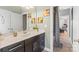 Bathroom with large vanity, solid surface countertop, and lots of light at 8514 Ellington Park Dr, Charlotte, NC 28277