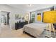 Comfortable bedroom with natural light, neutral decor, and a view to an ensuite bathroom at 8514 Ellington Park Dr, Charlotte, NC 28277