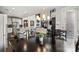 Open dining area adjacent to the kitchen, with hardwood floors and a view to the living room at 8514 Ellington Park Dr, Charlotte, NC 28277