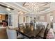 Bright dining room with hardwood floors, decorative ceilings, and an adjacent office space at 8514 Ellington Park Dr, Charlotte, NC 28277