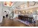 Spacious dining room featuring hardwood floors, elegant lighting, and neutral wall tones at 8514 Ellington Park Dr, Charlotte, NC 28277