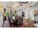 Elegant dining room with tray ceiling, chandelier, and hardwood floors at 8514 Ellington Park Dr, Charlotte, NC 28277