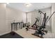 Bright room with exercise equipment, natural light, and carpeted floors at 8514 Ellington Park Dr, Charlotte, NC 28277