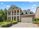 Beautiful two-story brick home with an attached garage and inviting curb appeal at 8514 Ellington Park Dr, Charlotte, NC 28277