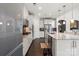 Modern kitchen featuring white cabinetry, stainless steel appliances, granite countertops, and hardwood floors at 8514 Ellington Park Dr, Charlotte, NC 28277
