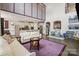 Spacious living room featuring high ceilings, hardwood floors, and an open layout to the modern kitchen at 8514 Ellington Park Dr, Charlotte, NC 28277