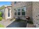 Outdoor patio area with seating, grill, and brick facade at 8514 Ellington Park Dr, Charlotte, NC 28277
