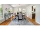 Elegant dining room featuring hardwood floors, chandelier lighting, and stylish furnishings at 8544 Houston Ridge Rd, Charlotte, NC 28277