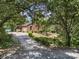 Home with a long driveway and beautiful green trees in the front yard at 8544 Houston Ridge Rd, Charlotte, NC 28277