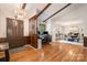 Inviting entryway boasting hardwood floors, a decorative chandelier, and an open view to the dining room at 8544 Houston Ridge Rd, Charlotte, NC 28277