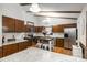 Well-equipped kitchen with stainless steel appliances, granite countertops, hardwood floors, and a center island at 8544 Houston Ridge Rd, Charlotte, NC 28277