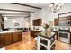 Modern kitchen with stainless steel appliances, hardwood floors, granite countertops, and an island with seating at 8544 Houston Ridge Rd, Charlotte, NC 28277