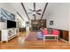 Cozy living room featuring a brick fireplace, wood beam ceiling, hardwood floors, and a comfortable seating area at 8544 Houston Ridge Rd, Charlotte, NC 28277
