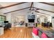 Spacious living room with vaulted ceilings, wood beams, hardwood floors, and open layout at 8544 Houston Ridge Rd, Charlotte, NC 28277