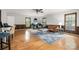 Bright living room with hardwood floors, a decorative rug, and comfortable seating area at 8544 Houston Ridge Rd, Charlotte, NC 28277