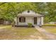 Charming home featuring a covered front porch, black trim, and landscaped yard at 10 Bolt Dr, Shelby, NC 28150