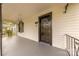 Inviting front porch featuring a black door, black trim, and covered seating area at 10 Bolt Dr, Shelby, NC 28150