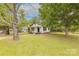 Quaint home exterior with mature trees and well-maintained lawn at 10 Bolt Dr, Shelby, NC 28150