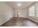 Bright living room with wood-look floors, wainscoting, and abundant natural light at 10 Bolt Dr, Shelby, NC 28150