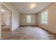 Spacious Living Room with wood-look floors, wainscoting and plenty of natural light at 10 Bolt Dr, Shelby, NC 28150
